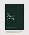 The State of You journal fra Superstate, med et mørkegrønt omslag, elegant hvit tekst og en gullpenn ved siden av.